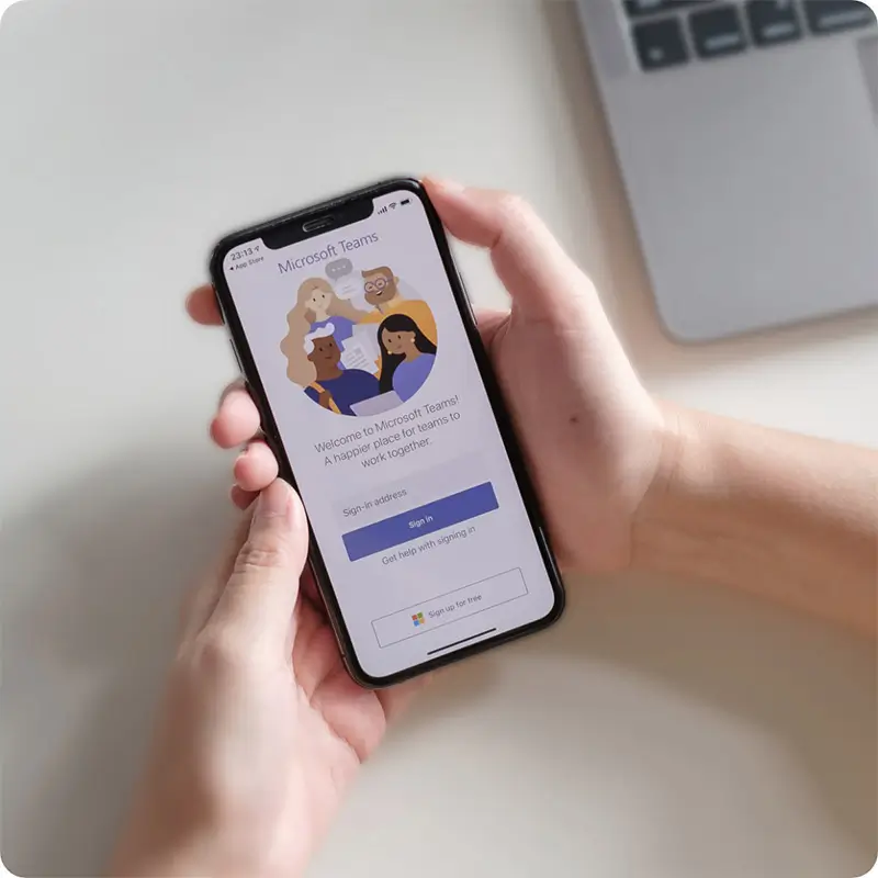 Holding a mobile phone in hand with Microsoft Teams app open